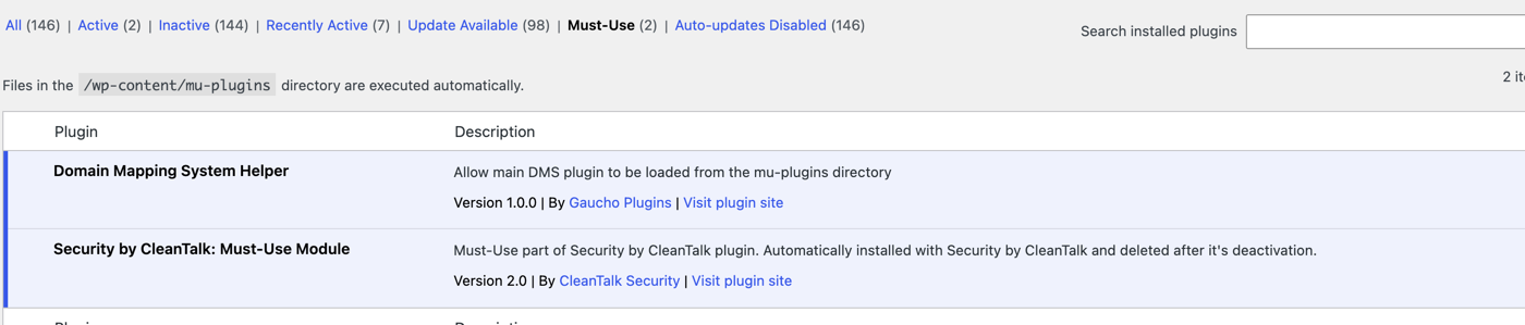 The WordPress Plugins page showing the Must-Use filter with two must-use plugins and the note that files in wp-content/mu-plugins are executed automatically.